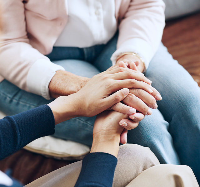 two people holding hands