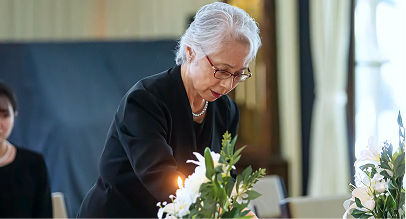 a woman paying her respects