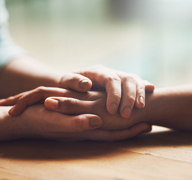 two people holding hands