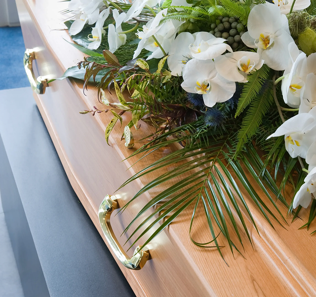 flowers on top of a coffin