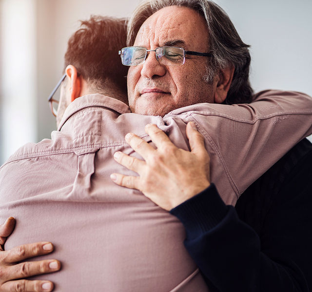 two men hugging