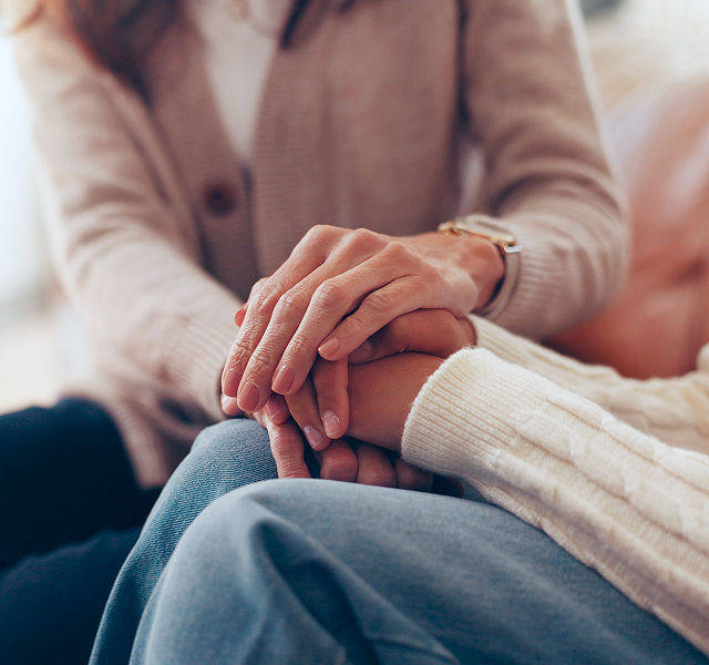 two people holding hands