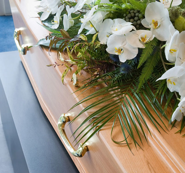 flowers on top of a coffin