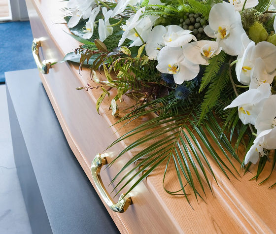 flowers on top of a coffin