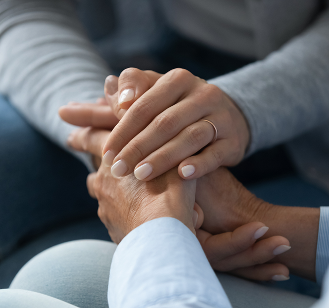 two people holding hands